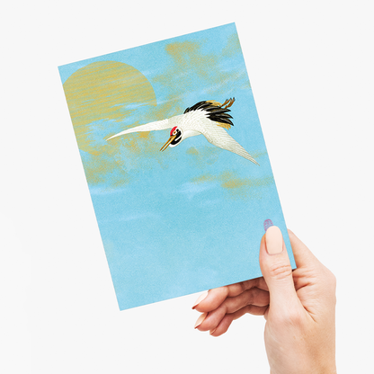 Sarus crane flying in front of the moon - Greeting Card