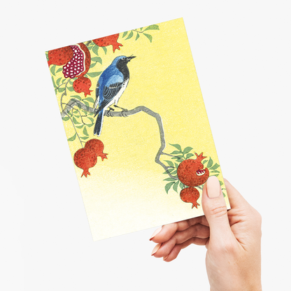 Blue robin perched on a pomegranate tree - Greeting Card