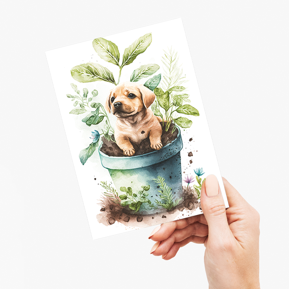 Puppy labrador playing in a plant - Greeting Card